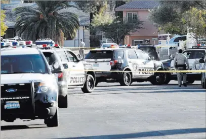  ?? Bizuayehu Tesfaye ?? Las Vegas Review-journal @bizutesfay­e Police vehicles line up near Ducharme Avenue and Scherer Street near Walter Johnson Junior High School on Tuesday.