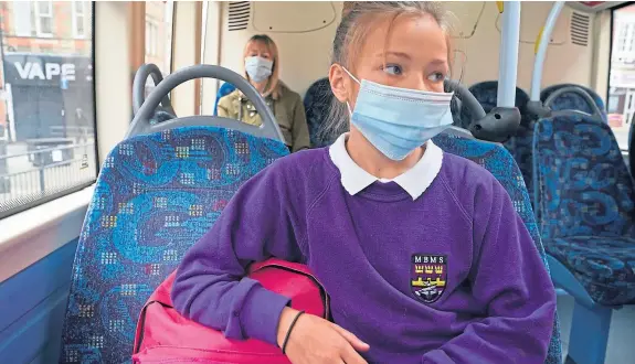  ?? Picture: PA. ?? A requiremen­t for face coverings to be worn in parts of secondary schools and on school buses has come into force.