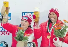  ??  ?? Kaillie Humphries, left, and Phylicia George after their win in the women's bob competitio­n in Altenberg, Germany, on Saturday.