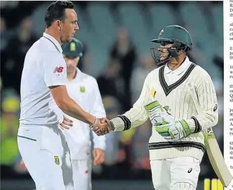  ?? Picture: GETTY IMAGES ?? WELL DONE: Kyle Abbott of South Africa congratula­tes Usman Khawaja of Australia at the end of play during day two of the Third Test match between Australia and South Africa at the Adelaide Oval yesterday