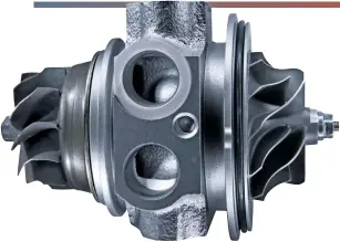  ??  ?? The heart of the turbocharg­er is the core. Pictured are the two wheels, one of which (turbine) is driven by the exhaust gases in one chamber; the other (compressor) spins and raises the pressure of the incoming air within another chamber. The central shaft is supported by bearings and lubricatin­g oil is prevented from contaminat­ing the chambers by separate seals.