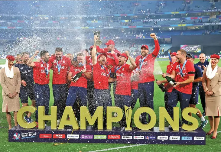  ?? Photo: ICC ?? England cricket players celebrate winning the the Internatio­nal Cricket Council Twenty20 World Cup final against Pakistan at the Melbourne Cricket Ground in Australia on November 14, 2022. England became the first team to hold the 50-over Cricket World Cup and 20-over Cricket World Cup at the same time.