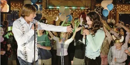  ?? FRED HAYES/DISNEY/TNS ?? Zac Efron as Troy Bolton and Vanessa Hudgens as Gabriella Montez in Disney Channel’s “High School Musical.”