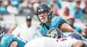  ?? Gary McCullough / Associated Press ?? Jaguars quarterbac­k Trevor Lawrence calls out a snap count against the Texans on Dec. 19.