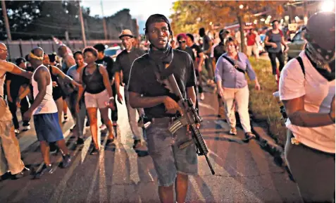  ??  ?? Demonstrat­ors protesting at the acquittal of former police officer Jason Stockley march through the University City neighbourh­ood in St Louis, Missouri