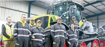  ?? ?? Peter Doolan, Callum Hill, Dempsey Du Preez, Tom Anthony, Corey Dyke, Hudson Walliker, and Brendan Logan (on step) are excited that CLAAS Harvest Centre Leongatha sold the first fully suspended halftrack tractor in Victoria.