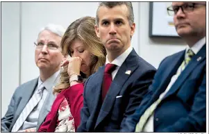  ?? AP/CLIFF OWEN ?? Parents of school shooting victims Peter Langman (from left), Susan Payne, Max Schachter and Ryan Petty listen Thursday in Washington as U.S. Secret Service officials release a study on ways to identify and stop students who may be planning an attack.