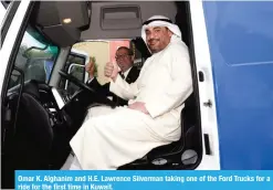  ??  ?? Omar K. Alghanim and H.E. Lawrence Silverman taking one of the Ford Trucks for a ride for the first time in Kuwait.