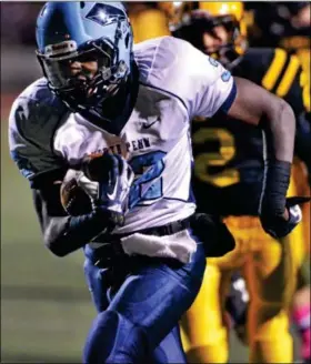  ?? MARK C PSORAS/THE REPORTER ?? NYFEASE WEST, 32, looks to help the North Penn football team win its eighth straight game in the District One Class AAAA first round Friday night.