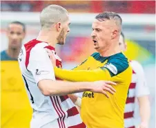  ??  ?? Leigh Griffiths squares up to Hamilton’s Alex Gogic.