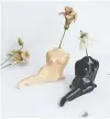  ?? - PHOTO: SUPPLIED ?? Goye: The feminine silhouette mini bud vases in nude and black, with hand-painted gold detailing.