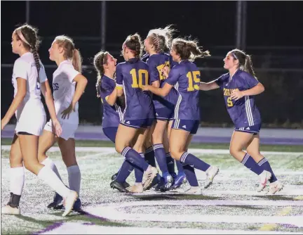  ?? MARK KEMPTON — FOR THE NEWS-HERALD ?? Kirtland players mob Macy McIntosh after her goal in the 33rd minute Nov. 10 during a Division III state semifinal against Liberty-Benton in Avon.