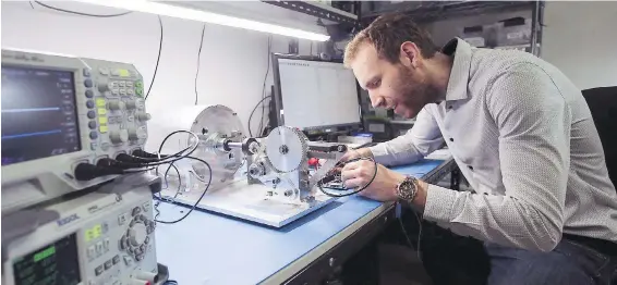  ??  ?? Electricia­n engineer Martin Kellinghus­en works on a project at StarFish Medical in April. The company has recently signed on new clients.