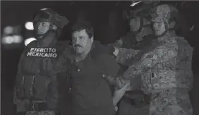  ?? PEDRO MERA/XINHUA FILE PHOTOGRAPH ?? Soldiers escort Joaquin “El Chapo” Guzman upon his arrival to the hangar of the Attorney General’s Office in Mexico City on Jan. 8, 2016.