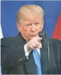  ??  ?? In a new poll, 73% say their minds are already made up about the impeachmen­t inquiry involving President Donald Trump.