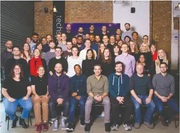  ?? Trint ?? Reporter-turned-tech CEO Jeff Kofman, seated in the middle of the front row, with
members of the Trint team in December 2019.