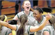  ?? NIKKI BOERTMAN / THE COMMERCIAL APPEAL ?? White Station’s Gigi Ford (15), and Kaila Beckwith (20) celebrate with teammates Thursday night during their AAA sectional win over host Bartlett. With the victory the Spartans earned their first trip to the TSSAA state volleyball tournament.