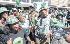  ?? AFP ?? Members of uMkhonto we Sizwe (MK), a new opposition party taking part in the May 29 South African election, sing and dance outside the High Court in support of former president Jacob Zuma in Johannesbu­rg on Aprill 11.