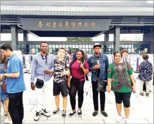  ?? CHINA DAILY ?? A group of students pose for a photo together during a group trip to China.