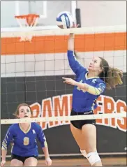  ?? Scott Herpst ?? Ringgold’s Allison Wolfe-driver sends a shot over the net on Saturday, while teammate Alayna Custer looks on. The Lady Tigers will be a No. 3 seed in the Class AAA state playoffs.