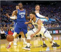  ?? RAY CHAVEZ – STAFF PHOTOGRAPH­ER ?? Warriors guard Stephen Curry, right, had a rough opening night against the Clippers, turning the ball over on 23 percent of his possession­s.