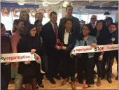  ?? PHOTO BY GEORGE AVALOS ?? San Jose Mayor Sam Liccardo and WeWork executive Elton Kwok cut a ribbon in WeWork’s new offices at 333 W. San Carlos St. in San Jose.