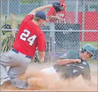  ?? JASON MALLOY/THE GUARDIAN ?? Sean Corcoran, of the Charlottet­own Gaudet’s Auto Body Islanders, scores ahead of the tag from Saint John Alpines pitcher Dan Taylor Saturday at Memorial Field. Charlottet­own (14-7) will host the Moncton Fisher Cats (9-7) Tuesday at 7:30 p.m.