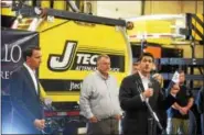  ?? PETE BANNAN — DIGITAL FIRST MEDIA ?? House Speaker Paul Ryan holds a pamphlet touting “A Better Way” for creating American jobs during a stop at J-Tech Inc. Thursday. With him is U.S. Rep. Ryan Costello, R-6, and business owner Scott Johnson.