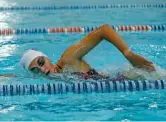  ?? KIRSTEN STICKNEY/SUN-TIMES ?? Evanston’s Sam Rhodes works on her stroke during practice Wednesday.