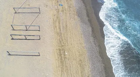  ??  ?? Cages and ditches are created along Turkey’s shores to ensure that loggerhead sea turtles have a safe nesting experience.