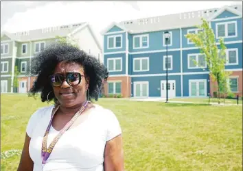  ?? Eddy Martinez / Hearst Connecticu­t Media ?? Charlene Colson stands in front of the Windward Apartments on Friday.