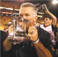  ?? Christian Petersen / Getty Images ?? Todd Graham, out as the Sun Devils coach, celebrates with the Territoria­l Cup after Arizona State beat Arizona on Saturday.