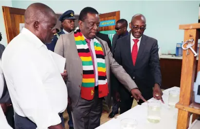  ??  ?? President Mnangagwa is shown purified water by Morton Jaffray Waterworks superinten­dent Mr Paul Chabata and Harare town clerk Engineer Hosiah Chisango in the laboratory during a tour of the waterworks yesterday. — Picture: John Manzongo