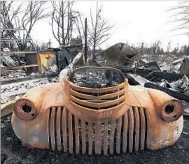  ?? Luis Sinco Los Angeles Times ?? A HOME LIES in ruins last month in Santa Rosa, Calif. A spate of recent wildfires killed 43 people and razed almost 9,000 structures in Northern California.