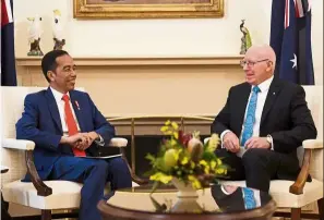  ??  ?? Warm welcome: Governor-General of australia david Hurley talkin to Jokowi during a ceremonial welcome at Government House in Canberra, australia. — reuters
