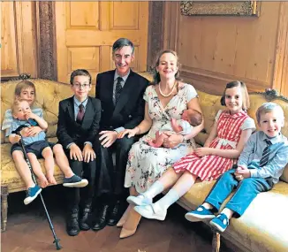  ??  ?? Jacob and Helena Rees-mogg on Instagram welcomed baby Sixtus Dominic Boniface Christophe­r, a brother for Peter, Mary, Thomas, Anselm and Alfred, above; the Hanlons, below, Ned, Bea, Kit, Posy, Mary and Clemmie with mum Alison and dad Tim