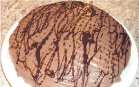  ?? COURTESY OF THE DECADENT DIABETIC ?? Replacing part of the flour with ground nuts cuts the carbohydra­tes in this Chocolate Cake Simple and Sweet.