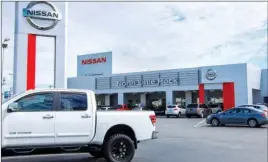  ?? LINDA GARNER-BUNCH/Arkansas Democrat-Gazette ?? Customers can save thousands on new 2014 models at North Little Rock Nissan.