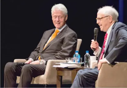  ?? ASHLEE REZIN/ SUN- TIMES ?? Former U. S. President Bill Clinton discusses his book and experience­s in politics with lawyer/ literary agent Bob Barnett on Thursday night at the Auditorium Theatre of Roosevelt University.