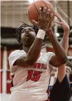  ?? ?? Dave Zajac/Hearst Connecticu­t Media Cromwell’s Victor Payne shoots against Morgan on Jan. 31.