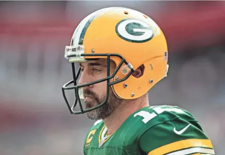  ?? MARY HOLT/NYT ?? Aaron Rodgers, then with the Green Bay Packers, takes the field for a game against the Buccaneers in Tampa, Fla., in 2022.