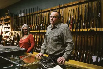  ?? Alexandra Hootnick / Special to The Chronicle ?? Shasta County Supervisor Patrick Jones (right) works with his sister, Jacqueline, in the family’s gun shop in Redding. Jones says the shift to the far right on the board is a course correction.
