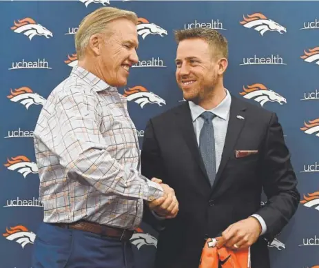  ?? John Leyba, The Denver Post ?? General manager John Elway welcomes the Broncos’ new starting quarterbac­k, Case Keenum, to Denver on Friday. After starring for the University of Houston, Keenum wasn’t selected in the 2012 draft. Now he has a two-year contract worth $36 million. “We...