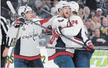  ??  ?? Lars Eller of the Washington Capitals is congratula­ted by teammates after scoring against the Golden Knights on Wednesday in Las Vegas.