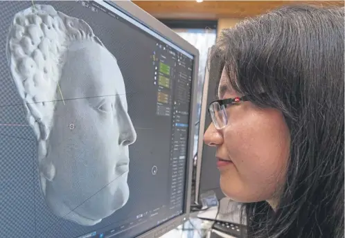  ?? ?? Yueqian Wang with the digital 3D model of Mary Queen of Scots’ death mask she created at Historic Environmen­t Scotland's conservati­on centre at the Engine Shed in Stirling, just a mile or so from where the queen was crowned in the Chapel Royal at Stirling Castle on 9 September 1543