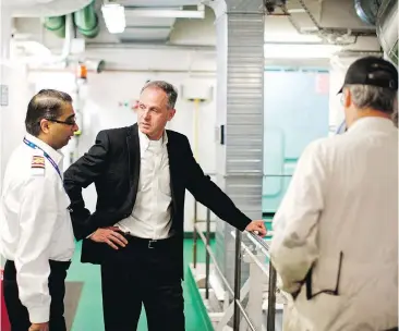  ??  ?? Mark Collins, B.C. Ferries president and CEO, centre, wakes up every day at 4:45 a.m., and is in the office before 6:30 a.m. His daily routines help with productivi­ty and creating a work-life balance.