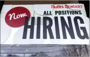  ?? NAM Y. HUH - THE ASSOCIATED PRESS FILE ?? A hiring sign at a restaurant in Rolling Meadows, Ill., on Dec. 27. On Thursday, the Labor Department reported fewer people applied for unemployme­nt benefits last week.
