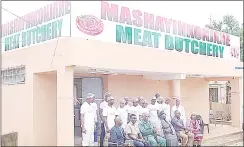  ?? (PICS: SIBUSISO ZWANE) ?? MASHAYINKO­NJANE MEAT BUTCHERY MD SIfiSO NHLENGETFW­A (seated 2ndL) POSING FOR A GROUP PHOTO WITH THE ELDERS OF THE MOTSA FAMILY (HIS LANDLORDS) AND STAFF MEMBERS DURING THE OFfiCIAL OPENING OF THE SIXTH BRANCH FOR HIS BUTCHERY BUSINESS.