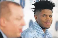  ?? JEFF WHEELER/STAR TRIBUNE VIA AP PHOTO ?? Justin Patton looks over at his new head coach, Tom Thibodeau as he speaks about Patton at a news conference Tuesday.