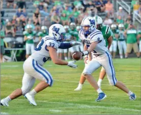  ?? PILOT PHOTO/BEV HARAMIA ?? This should be a common sight during the Laville-culver game as both teams rely on the running game. Pictured here is the Lancers’ Lucas Plummer handing off to Paul Dewitt.